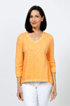 Elliott Lauren V Neck Seam Detail Tee in Tiger Lily, a light orange. V neck garment dyed 3/4 sleeve top. Wrapped contour seams from front to back. Asymmetric hem. Rib detail at neck hem and cuff. Relaxed fit._t_35201251279048