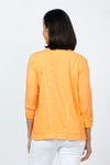 Elliott Lauren V Neck Seam Detail Tee in Tiger Lily, a light orange. V neck garment dyed 3/4 sleeve top. Wrapped contour seams from front to back. Asymmetric hem. Rib detail at neck hem and cuff. Relaxed fit._t_35201251377352