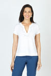 Elliott Lauren Mirror Image Top in White.  Banded crew with split v placket.  Embossed mirrored appliques around neckline and placket and down shoulder and center sleeve.  Short sleeve with sewn cuff.  Classic fit._t_60215254057326