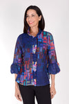 Frederique Ruffle Squares Jacket in Blue Multi.  Abstract geometric print in bright colors on a royal blue base.  Button front jacket with ruffle trim at neck and button placket.  Adjustable wire collar. 3/4 sleeve with puffed cuff.  Relaxed fit._t_34616135057608