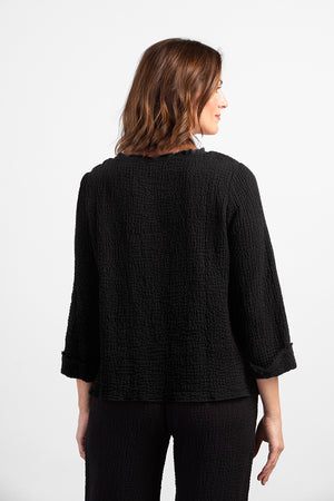 Habitat Pattern Play Pocket top in Black. Textured crew neck top with cuffed 3/4 sleeve. Center front lapped seam. Front hem insert with inset pockets. Plain back. Fringed edges at neck, cuff, front seam and pockets. A line shape. Relaxed fit._34551140745416