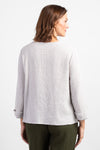 Habitat Pattern Play Pocket top in Putty. Textured crew neck top with cuffed 3/4 sleeve. Center front lapped seam. Front hem insert with inset pockets. Plain back. Fringed edges at neck, cuff, front seam and pockets. A line shape. Relaxed fit._t_34656760725704