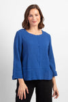 Habitat Pattern Play Pocket top in Baltic blue. Textured crew neck top with cuffed 3/4 sleeve. Center front lapped seam. Front hem insert with inset pockets. Plain back. Fringed edges at neck, cuff, front seam and pockets. A line shape. Relaxed fit._t_34656761217224
