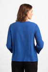 Habitat Pattern Play Pocket top in Baltic blue. Textured crew neck top with cuffed 3/4 sleeve. Center front lapped seam. Front hem insert with inset pockets. Plain back. Fringed edges at neck, cuff, front seam and pockets. A line shape. Relaxed fit._t_34656760660168