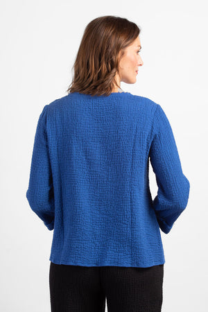 Habitat Pattern Play Pocket top in Baltic blue. Textured crew neck top with cuffed 3/4 sleeve. Center front lapped seam. Front hem insert with inset pockets. Plain back. Fringed edges at neck, cuff, front seam and pockets. A line shape. Relaxed fit._34656760660168