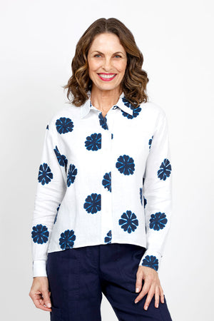 Elliott Lauren Sand Dollar Blouse in White with dark blue sand dollar print.  Pointed collar button down long sleeve blouse with button cuff.  High low hem.  Side slits. Relaxed fit._35419568111816