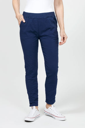 Organic Rags Pull on Solid Pant in  Navy. Elastic waist pull on pant. 2 front slash pockets, 2 rear patch pockets. Slightly crinkled fabric with enough stretch for comfort. Slim leg. Convertible hem. 27 1/2" inseam unrolled._34995632341192