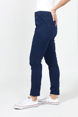 Organic Rags Pull on Solid Pant in Navy. Elastic waist pull on pant. 2 front slash pockets, 2 rear patch pockets. Slightly crinkled fabric with enough stretch for comfort. Slim leg. Convertible hem. 27 1/2" inseam unrolled._34995632275656