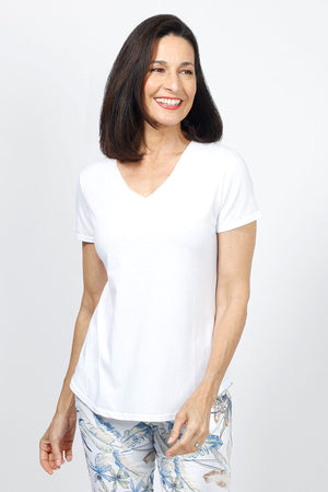 Organic Rags Happy V Neck Tee in White. V neck short sleeve top with raw edge at banded neckline. Slightly faded wash. Smiley face embroidered at back neckline. Relaxed fit._34960621174984