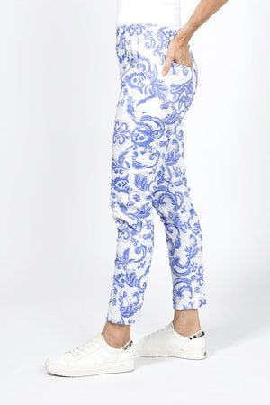 Organic Rags Damask Print Pant in Royal. Scroll print on a white background. Elastic waist pull on pant with 2 slash pockets. No wrinkle pre crinkled fabric. Slim through leg. Convertible hem. 27" inseam._34960586473672