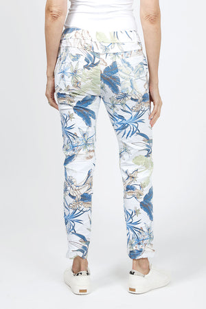 Organic Rags Banana Leaf Pant in White with blue and green banana leaf print. Elastic waistband with 2 slash pockets. Crinkle fabric. 28" unrolled._34960566452424