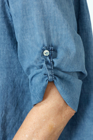 Organic Rags Roll Tab Sleeve Top in Navy.  Modified scoop neck with 2 button placket and pin tucks at front neckline.  3/4 sleeve with roll button tab.  High low hem.  Relaxed fit._59972845797742
