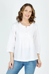 Organic Rags Roll Tab Sleeve Top in White.  Modified scoop neck with 2 button placket and pin tucks at front neckline.  3/4 sleeve with roll button tab.  High low hem.  Relaxed fit._t_59972845502830