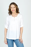 Organic Rags Roll Tab Sleeve Top in White.  Modified scoop neck with 2 button placket and pin tucks at front neckline.  3/4 sleeve with roll button tab.  High low hem.  Relaxed fit._t_59972845535598