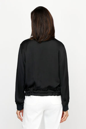 Lolo Luxe Washable Silk Zip Jacket in Black.  Banded ribbed crew neck with zip front and silver sipper.  Long sleeves with ribbed cuff.  Banded hem with adjustable drawstring.  Relaxed fit._61252024271214
