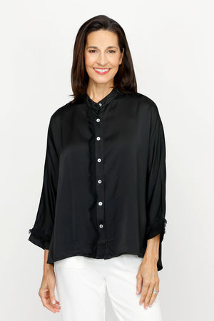 Lolo Luxe Washable Silk Button Down in Black.  Banded crew neck button down with 3/4 sleeve and cuff.  Fringed chiffon raw edge trim at right placket and on cuff.  High low hem.  Relaxed fit._61251999629678