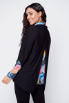 Claire Desjardins Winter Bouquet Cowl Neck Top. Bright abstract floral bouquet print. Cowl neck long sleeve top. Double layer with bottom print and black overlay. Top piece is shorter than lower piece. Split in half in back to reveal underneath print. Drawstring cowl. Relaxed fit._t_34516571881672