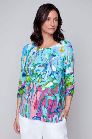 Claire Desjardins So Much Garden Dolman sleeve Top.  Bright blue, pink and green abstract floral garden design.  Crew neck, 3/4 length dolman sleeve.  Slightly curved hem.  Relaxed fit._35184181444808