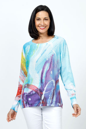Claire Desjardins This Side of Home Sweater in blue, purple multi.  Abstract swirl print lightweight knit.  Crew neck with long dolman sleeves.  Sweater is knit side to side.  Rib trim at neck, hem and cuffs.  Relaxed fit._35183004385480