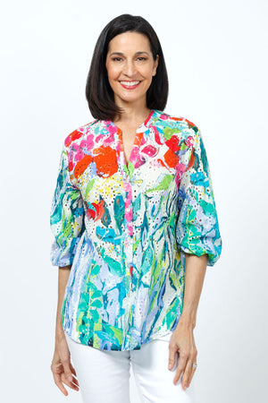 Claire Desjardins at liberty in the garden Eyelet Blouse.  Bright red green  blue and white abstract print.  Banded crew with notch vee.  Elbow length sleeves with elastic cuff. Button down.Relaxed fit._35182676443336