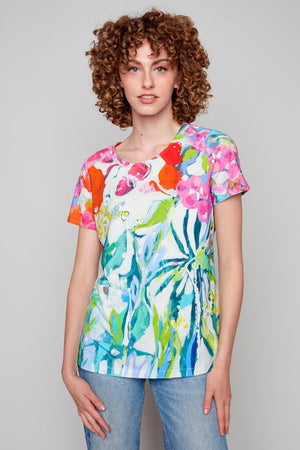 Claire Desjardins At Liberty in the Garden Button Pocket Top.  Bright abstract floral print.  Crew neck short sleeve top with a single button pocket on front.  Side slits.  A line shape.  Relaxed fit._35071858344136