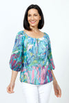 Claire Desjardins So Much Garden Off the Shoulder Top.  Multi colored abstract floral print.  Elastic scoop neck top with 3/4 length sleeve with elastic cuff.  Lined through body; sheer sleeves.  Swiss dotted fabric.  Relaxed fit._t_35182910013640