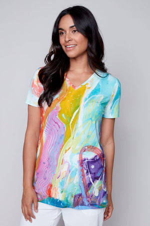 Claire Desjardins This Side of Home V Neck Tee in Multi.  V neck short sleeve tee with a line shape and side slits.  Bright abstract watercolor artist inspired print.  Relaxed fit._35071878824136