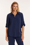 Mododoc Roll Tab Patch Pocket Tunic in Vibrant Navy. Pointed collar open placket popover top. 3/4 sleeve with roll tab. Single patch pocket. Curved high low hem. Relaxed fit._t_60189607887214