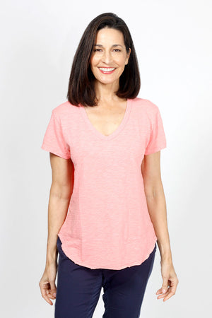 Mododoc Short Sleeve V Neck with Curved Hem in Coral Essence. V neck short sleeve high low tee. Raw edges. Relaxed fit._34970779386056