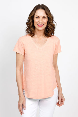 Mododoc Short Sleeve V Neck with Curved Hem in Melon. V neck short sleeve high low tee. Raw edges. Relaxed fit._35438820851912