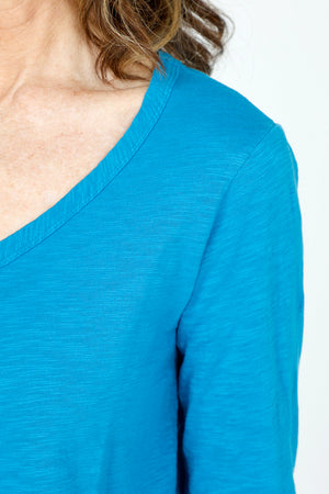 Mododoc 3Q Sleeve V neck Tee in Calypso Blue.  V neck slub 
cotton tee with 3/4 sleeve.  Curved hem with raw edge.  Relaxed fit._59543042949486
