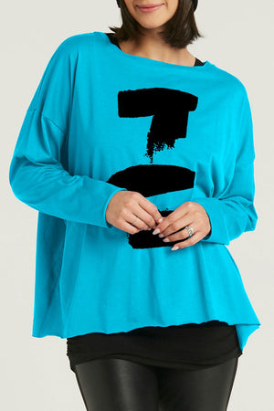 Planet Boxy Brush Stroke T in Turquoise with Black abstract brush stroke design on center front.  Crew neck long sleeve oversized pima cotton tee.  Boxy fit._35335530447048