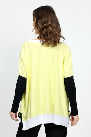 Planet Color Block Oversized Crew Sweater in Citron with black and white colorblocking. Crew neck oversized sweater with citron body. Drop shoulder. Long black sleeves. White trim at neckline and hem. Side slits. Inverted u-shaped hem. One size fits many._34933022458056