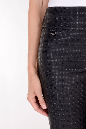 Lisette L Montreal Bronaugh Houndstooth Straight Trouser in Black. Tone on tone houndstooth jacquard created from shiny and matte fabric. Pull on pant with straight leg. 30" inseam. 8" leg opening._34358938435784