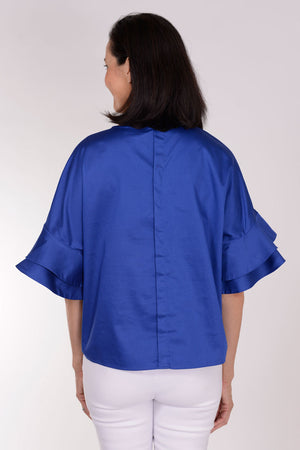 Perlavera Cozy Cotton Ruffle Sleeve Top in Electric Blue. Crew neck top with 1 button closure in back. Dolman short sleeve with double ruffle. Boxy fit. One size fits many._34330894696648