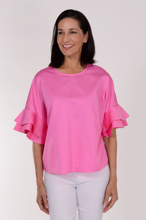 Perlavera Cozy Cotton Ruffle Sleeve Top in Pink. Crew neck top with 1 button closure in back. Dolman short sleeve with double ruffle. Boxy fit. One size fits many._34330894827720