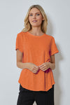 Mododoc Crew Neck High/Low Tee in Orange Clay. Crew neck tee with short sleeves. Curved high low hem. Relaxed fit._t_59880723677550