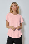 Mododoc Crew Neck High/Low Tee in Pink Flamingo. Crew neck tee with short sleeves. Curved high low hem. Relaxed fit._t_59880723743086