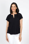 Mododoc Ruffle Henley Swing Tee in Black. Crew neck with open v placket. Raglan short sleeve. Ruffle at neck. Swing shape. Raw edges. Relaxed fit._t_35299706732744