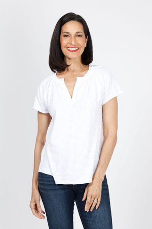 Mododoc Ruffle Henley Swing Tee in White. Crew neck with open v placket. Raglan short sleeve. Ruffle at neck. Swing shape. Raw edges. Relaxed fit._35299707093192