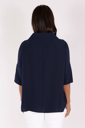 Suzy D Audrey Cowl Neck Top in Navy. Draped cowl neck with dropped shoulder and elbow length sleeve. Side slits. High low hem. Relaxed fit._34236625354952