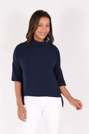 Suzy D Audrey Cowl Neck Top in Navy. Draped cowl neck with dropped shoulder and elbow length sleeve. Side slits. High low hem. Relaxed fit._34236624502984