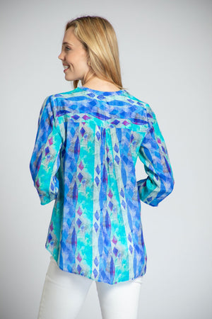 APNY Diamond Tassel Top in Blue Multi. Gradient vertical stripes with inset diamond pattern. Crew neck with split front with attached tassel ties. Banded collar. 3/4 flowy sleeve. Flutter hem. Relaxed fit._34953897902280