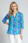 APNY Diamond Tassel Top in Blue Multi.  Gradient vertical stripes with inset diamond pattern.  Crew neck with split front with attached tassel ties.  Banded collar.  3/4 flowy sleeve.  Flutter hem.  Relaxed fit._t_34953897836744