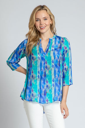 APNY Diamond Tassel Top in Blue Multi.  Gradient vertical stripes with inset diamond pattern.  Crew neck with split front with attached tassel ties.  Banded collar.  3/4 flowy sleeve.  Flutter hem.  Relaxed fit._34953897836744