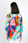 APNY Abstract Tassel Top in Multi. Bright abstract swirl pattern. Crew neck split neck top with banded collar and tassel ties. 3/4 sleeve. Swing shape. Relaxed fit._t_34953581953224