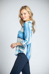 APNY Watercolor Juxtaposed Blouse in Blue. Soft stripes combine in a directional print. 1/2 of the front is vertical - the other horizontal. Long sleeves with button cuffs and roll button tabs. Back yoke. Shirt tail hem. Relaxed fit._t_34770854281416