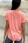 Billy T Ruffle V Neck Tee in Citrus, a light orange. V neck slub tee with short ruffle hem sleeve. High low curved hem. Raw edges. Relaxed fit._t_34304994410696