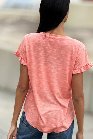 Billy T Ruffle V Neck Tee in Citrus, a light orange. V neck slub tee with short ruffle hem sleeve. High low curved hem. Raw edges. Relaxed fit._34304994410696