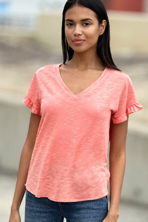 Billy T Ruffle V Neck Tee in Citrus, a light orange.  V neck slub tee with short ruffle hem sleeve.  High low curved hem.  Raw edges.  Relaxed fit._34304994279624